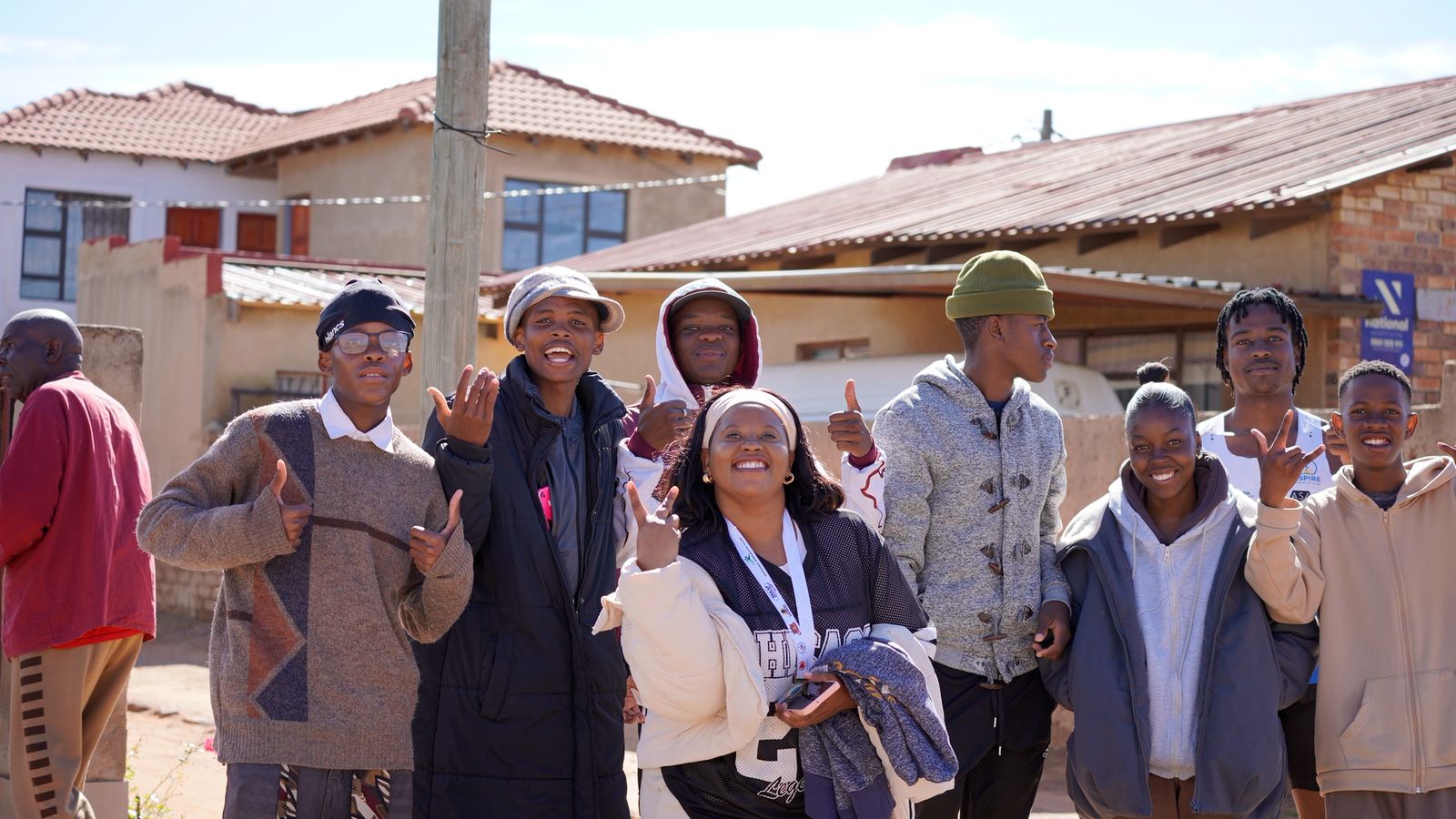 Foundation representatives standing with community members