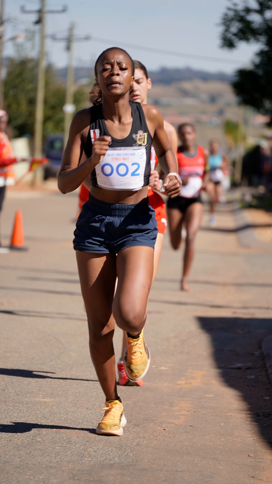 Young runners leading a race
